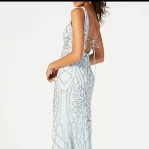 Never worn, beaded gown. Beautiful lines. Adrianna Papel size 4.
